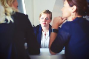 A woman is interviewed for a new position